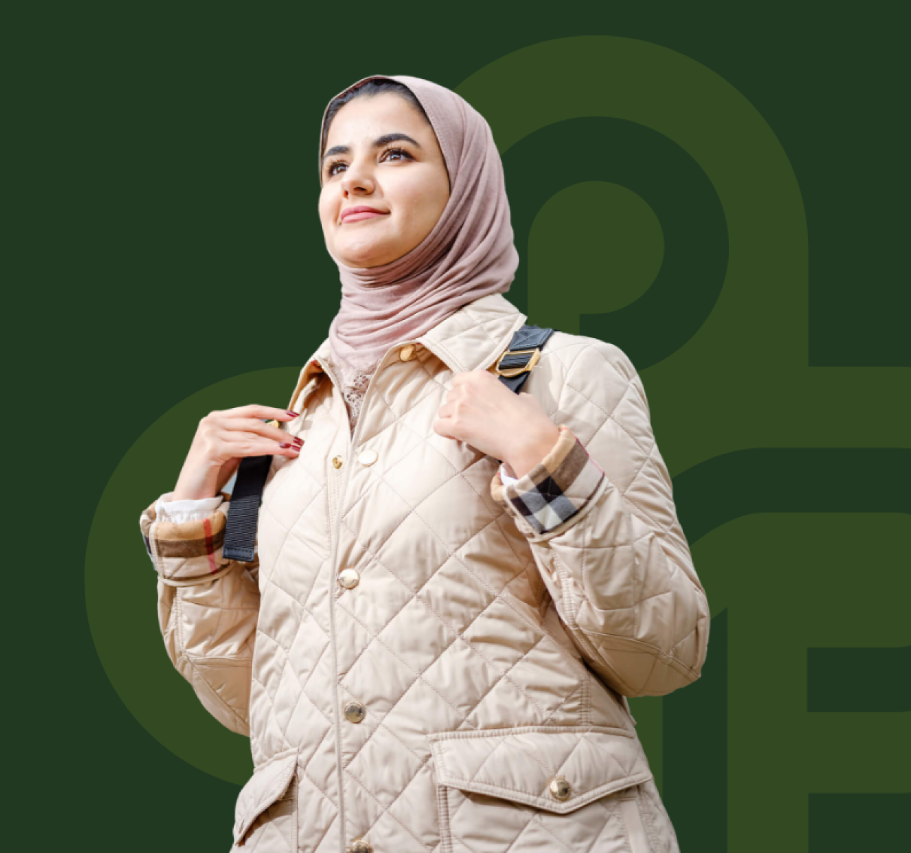 student with backpack smiling